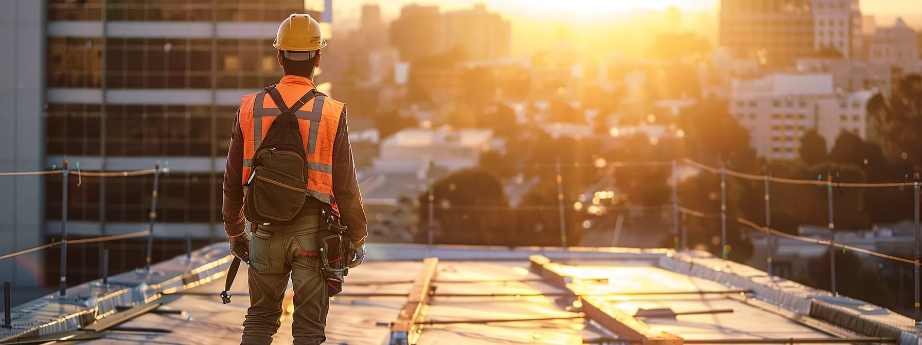 a vibrant rooftop scene captures a skilled roofer diligently working under bright sunlight, surrounded by the bustling urban landscape, showcasing the importance of targeted advertising for roofing professionals.